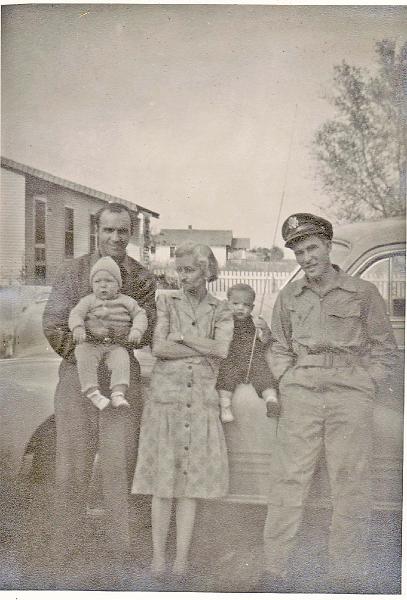 Granny in the middle.jpg - From left to right, Lester HenryTurner holding Lester Howard Turner (son), Bulah Speed Turner (grandmother), Dale Edmond Turner (Lester's son), and Wesley Woodson Turner (boy's uncle and Lester's brother).
